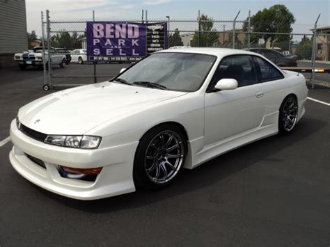  back bumber bunnet front bumber Front lights s15 Fiber bunnet light weight Front s15 bumber Orginal tail lights s14 Nissan silvia spoiler Car has been painted to white color. . S14 for sale